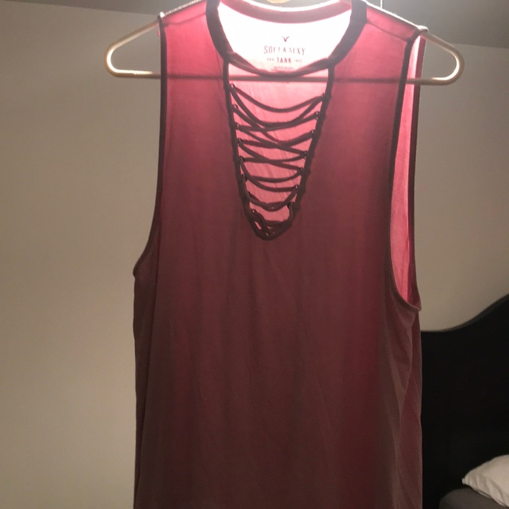 Light pink tank top with cross strings